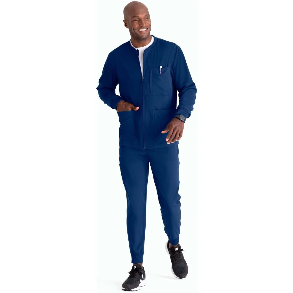 Men's React Warmup Scrub Jacket - Greys Anatomy Spandex Stretch Collection / Color - Indigo / Fit - Regular / Sizes - XS, S, M, L, XL, 2XL, 3XL by Barco Uniforms
